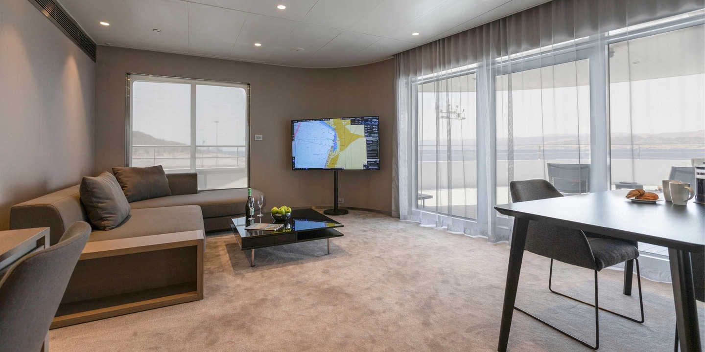 A large and spacious separate lounge in the top cabin grade on board an Emerald Cruises yacht