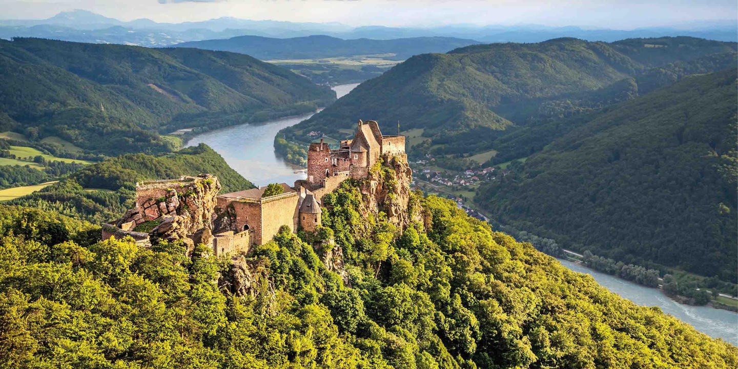 Durnstein Castle on top of a green hill in the Wachau Valley of Austria on the banks of the Danube River