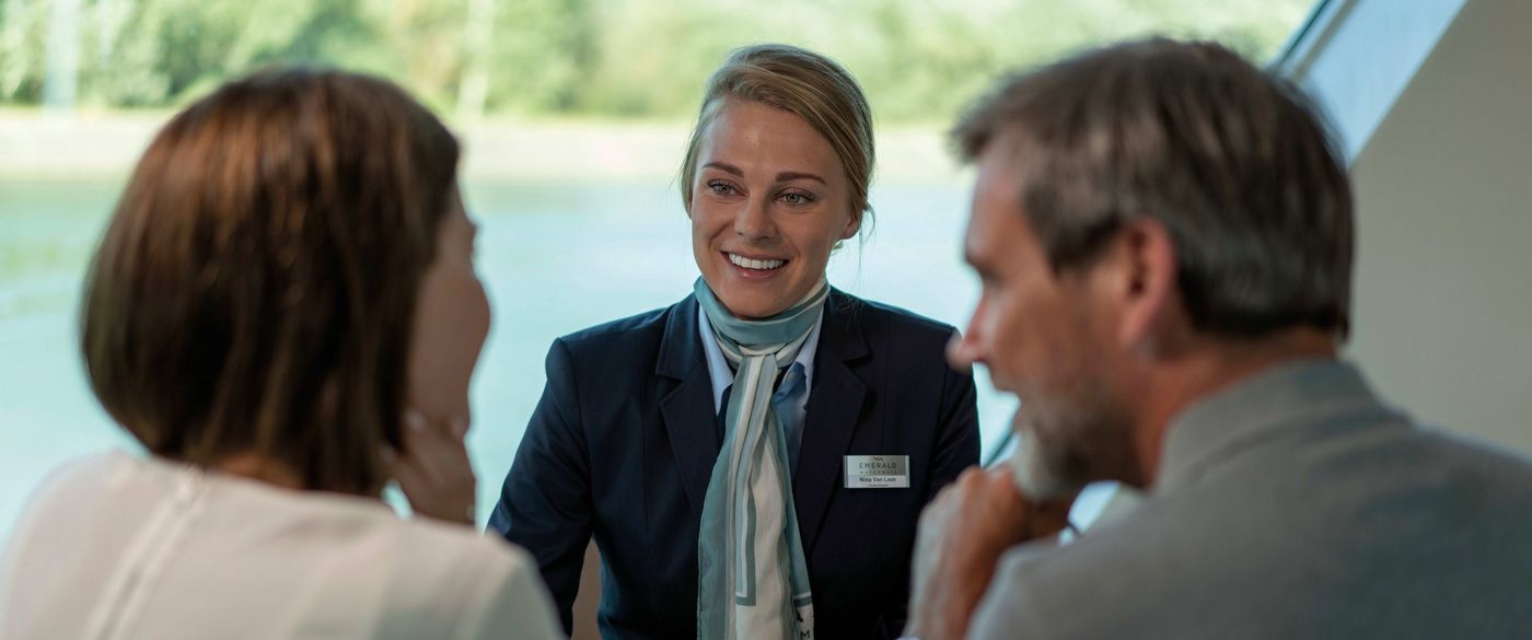 Emerald cruise director with two guests