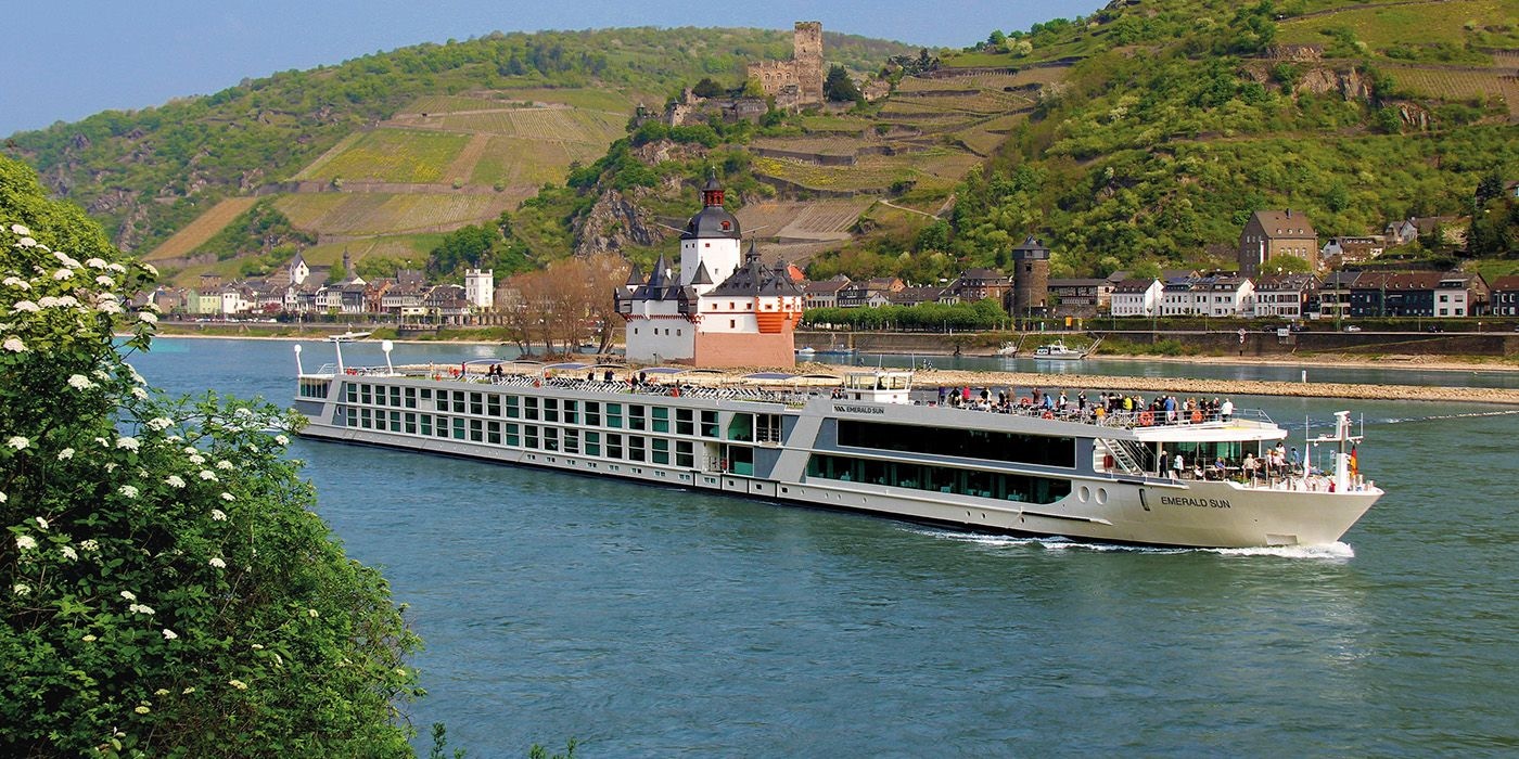 Three cruise guests enjoying the putting green